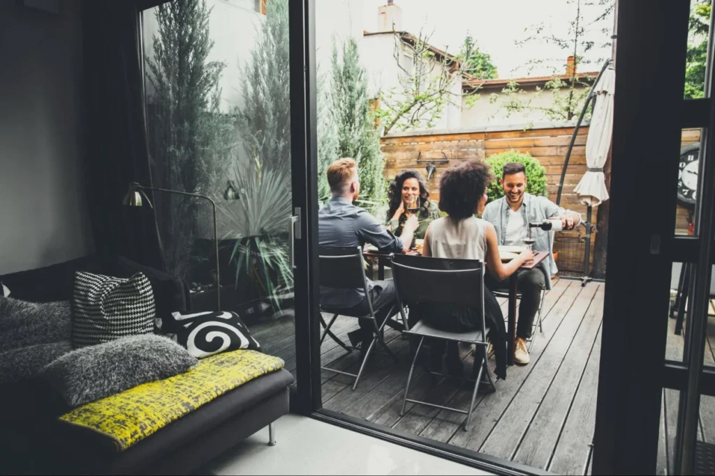 Friends dining together in an outdoor patio table area